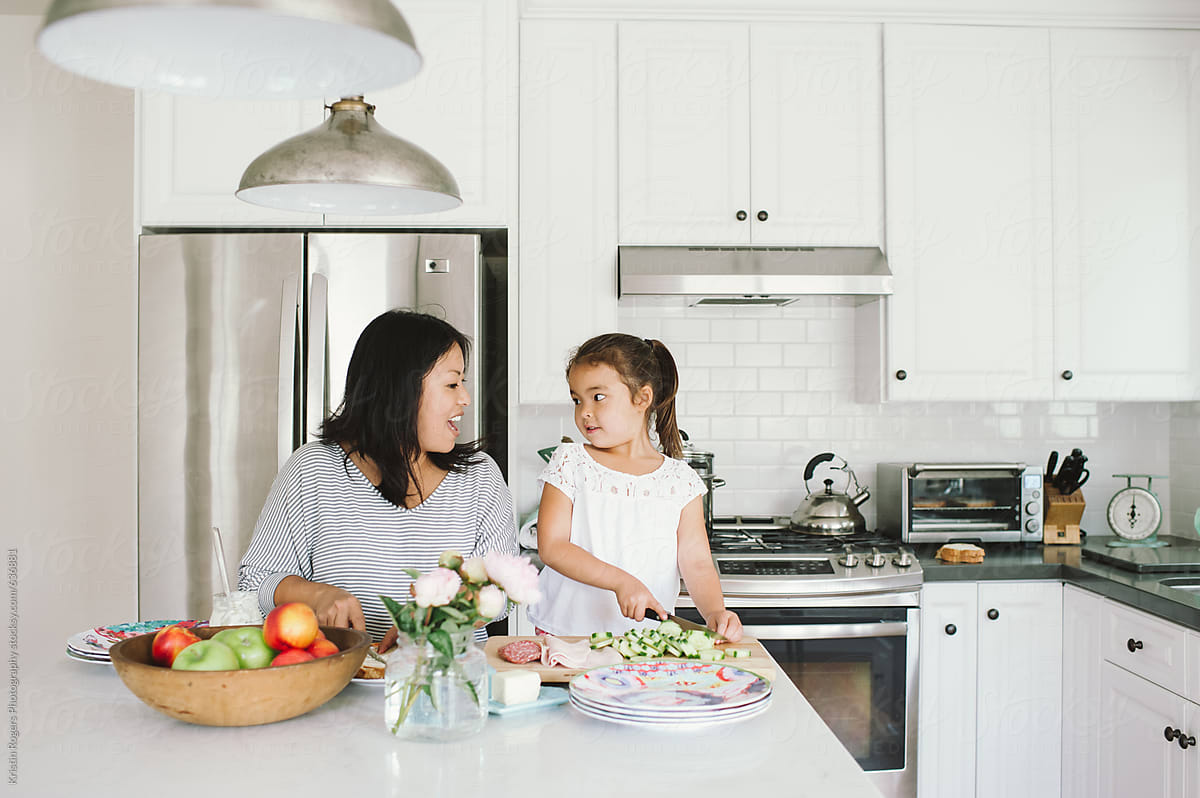 Mom And Daughter Making Lunch Together In Kitchen By Stocksy