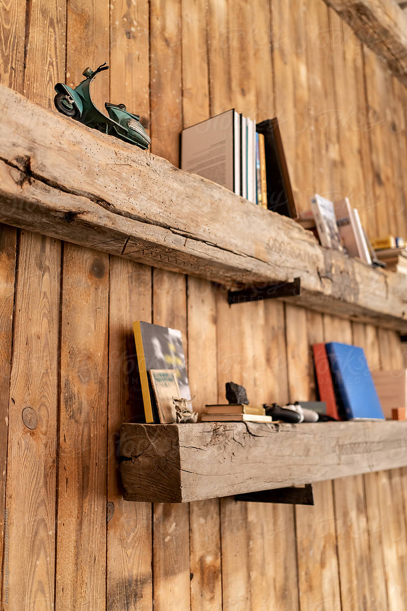 Shelves from wood beams inside wooden apartment