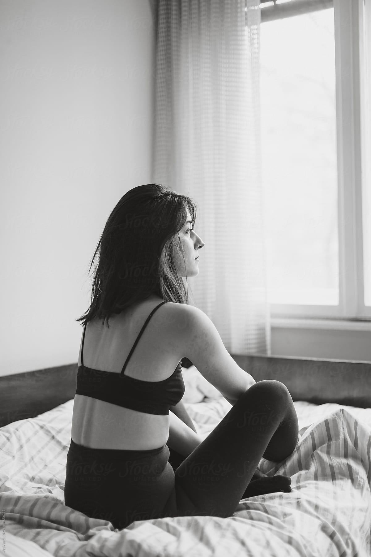 Close Up Of Woman In Underwear On The Bed by Stocksy Contributor