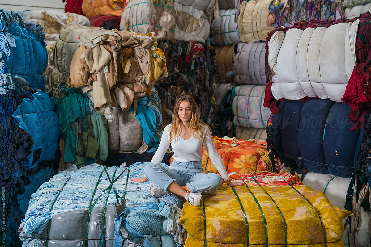 Young Woman in a Fabrics Recycling Warehouse