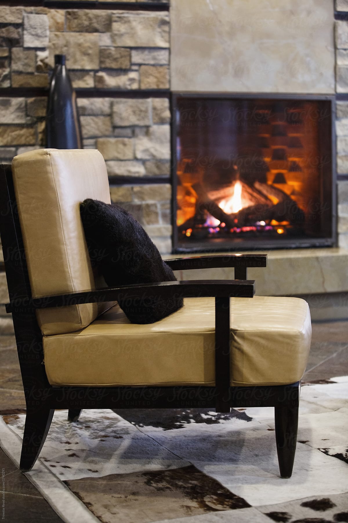 Chair at luxury ski resort by fireplace