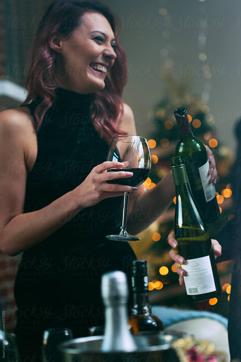 NYE: Woman Celebrating Holiday With Glass Of Wine