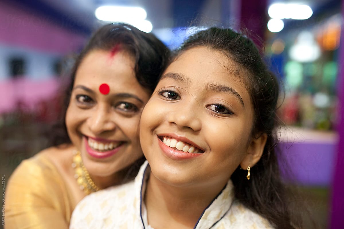 Teenager with a beautiful and cheerful Indian Woman