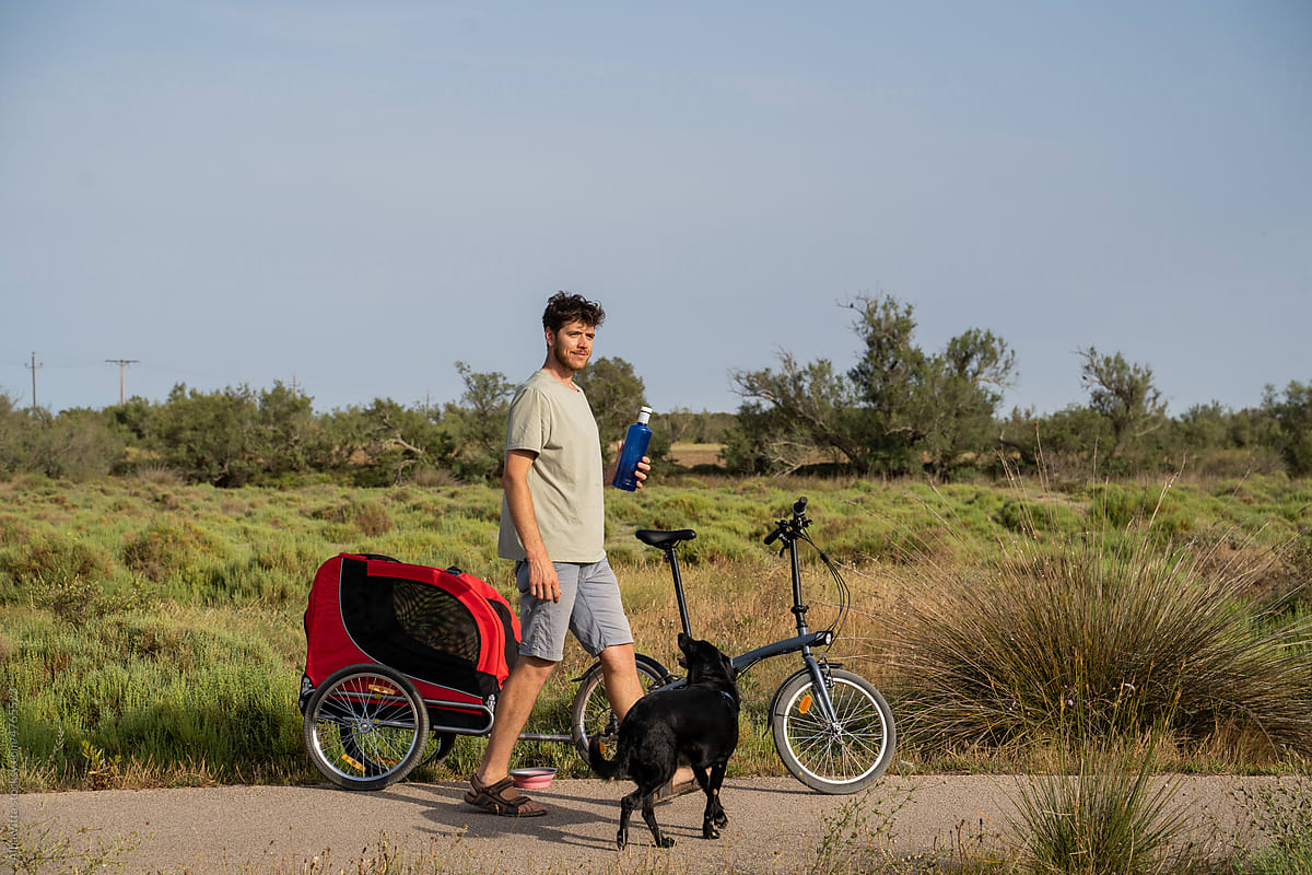 Man going for a bike stroll with dog trailer