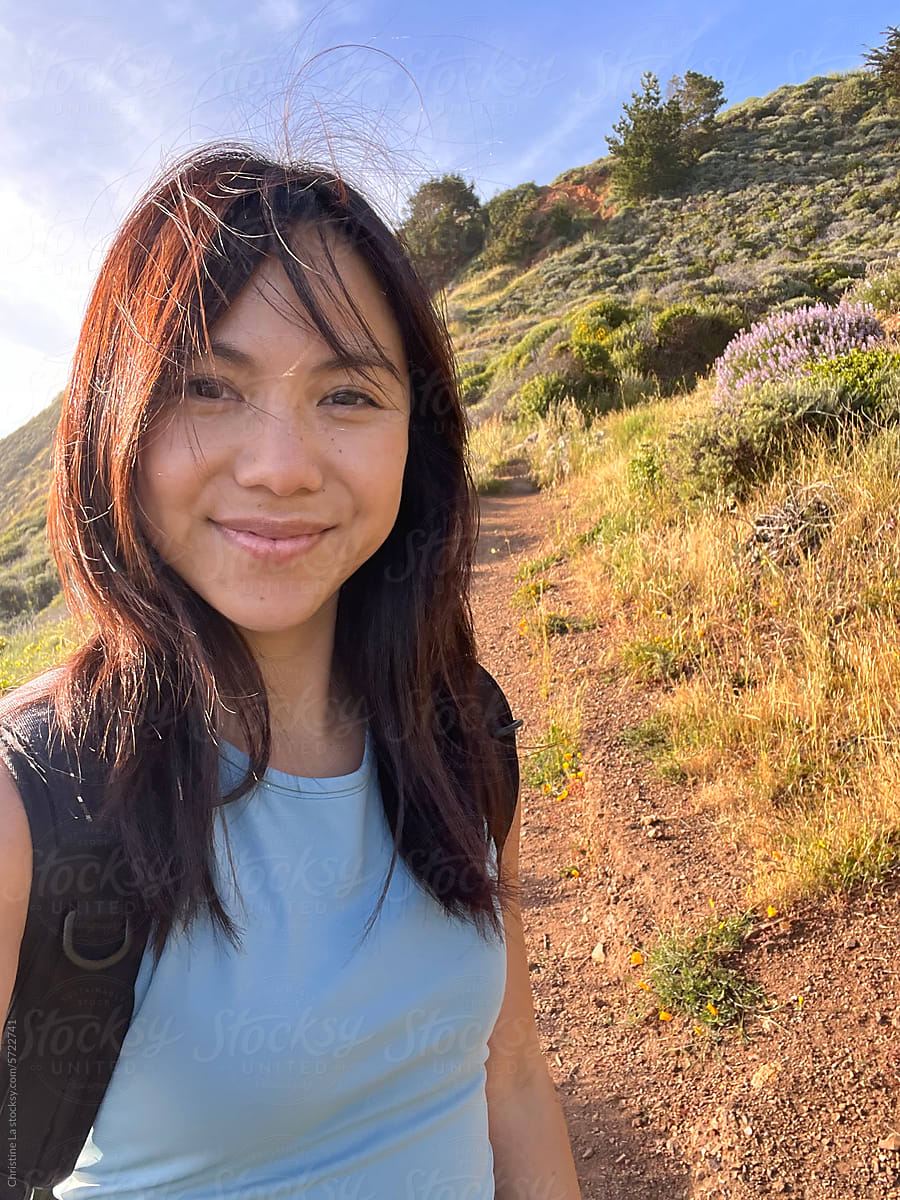 Real ugc selfie of young woman on a hike