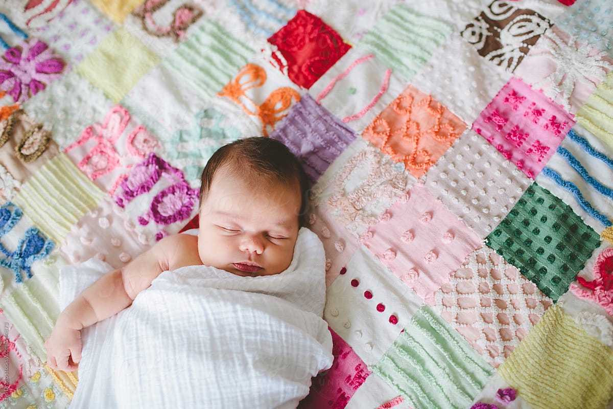 baby girl on quilt