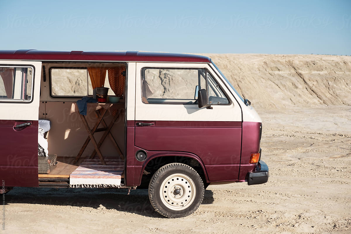 Van with opened door in desert
