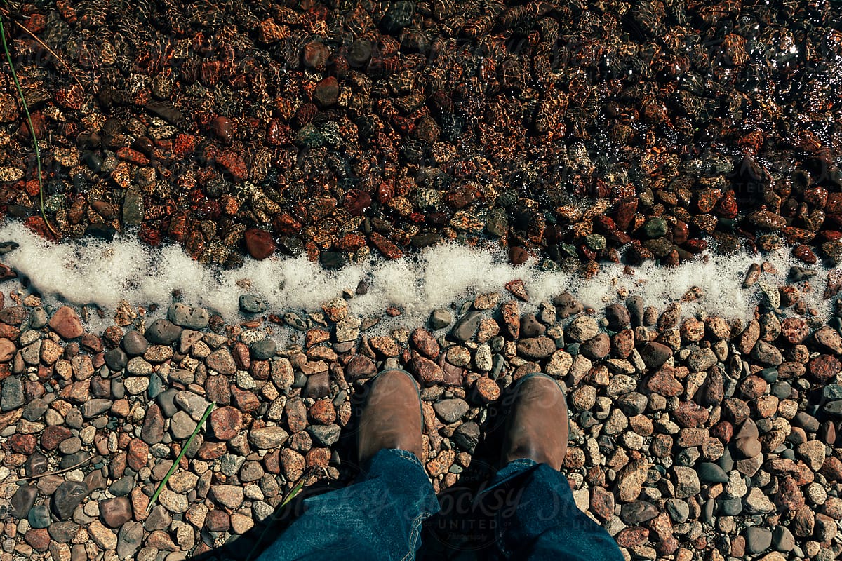 Legs at Lake Shore Pebbles and Surf