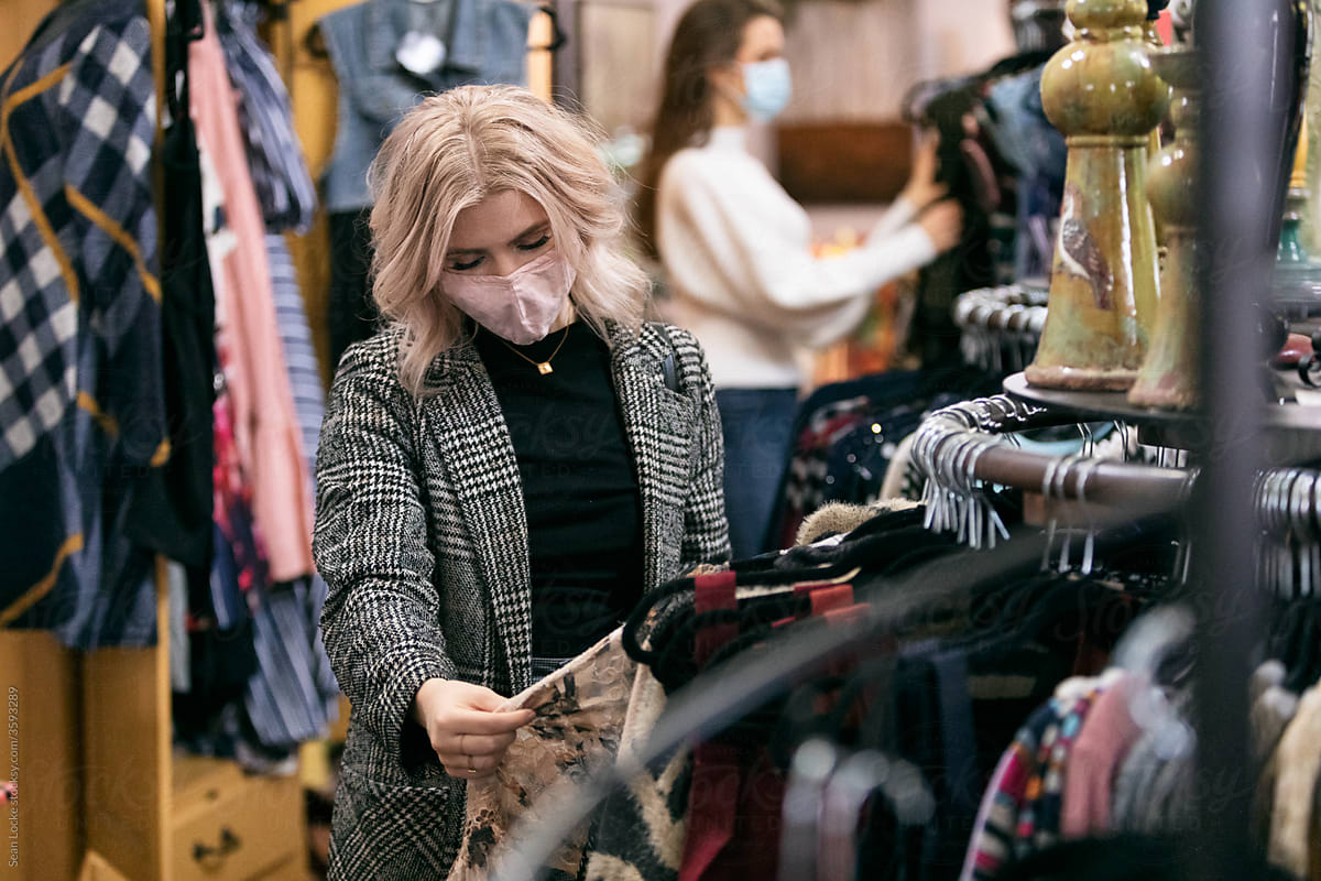 Shopping: Woman Wearing Face Mask Shops In Boutique