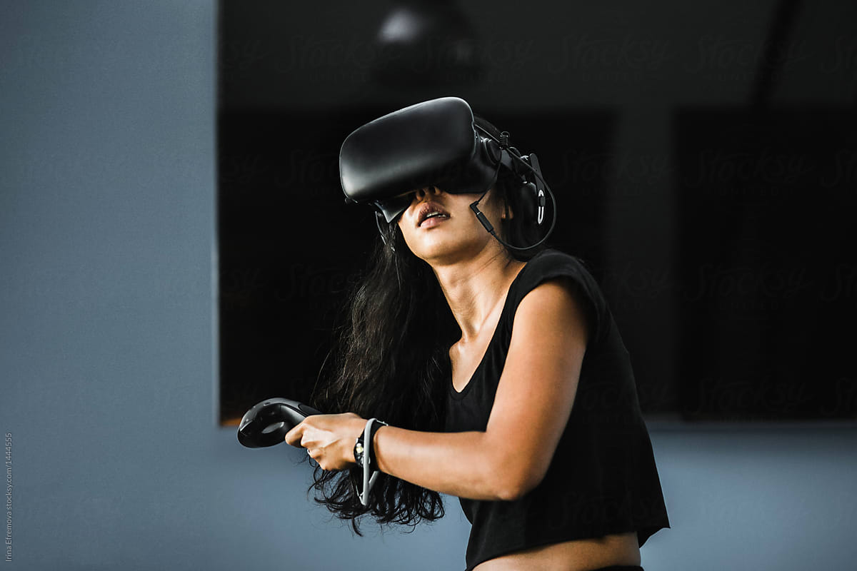 South East Asian Girl Playing Vr Game By Stocksy Contributor Irina 