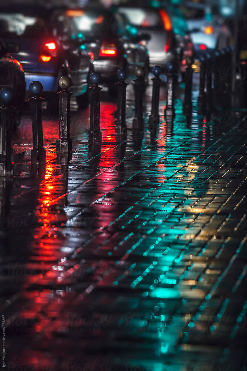 street atmosphere, rain, cars,green  red reflections, vertical