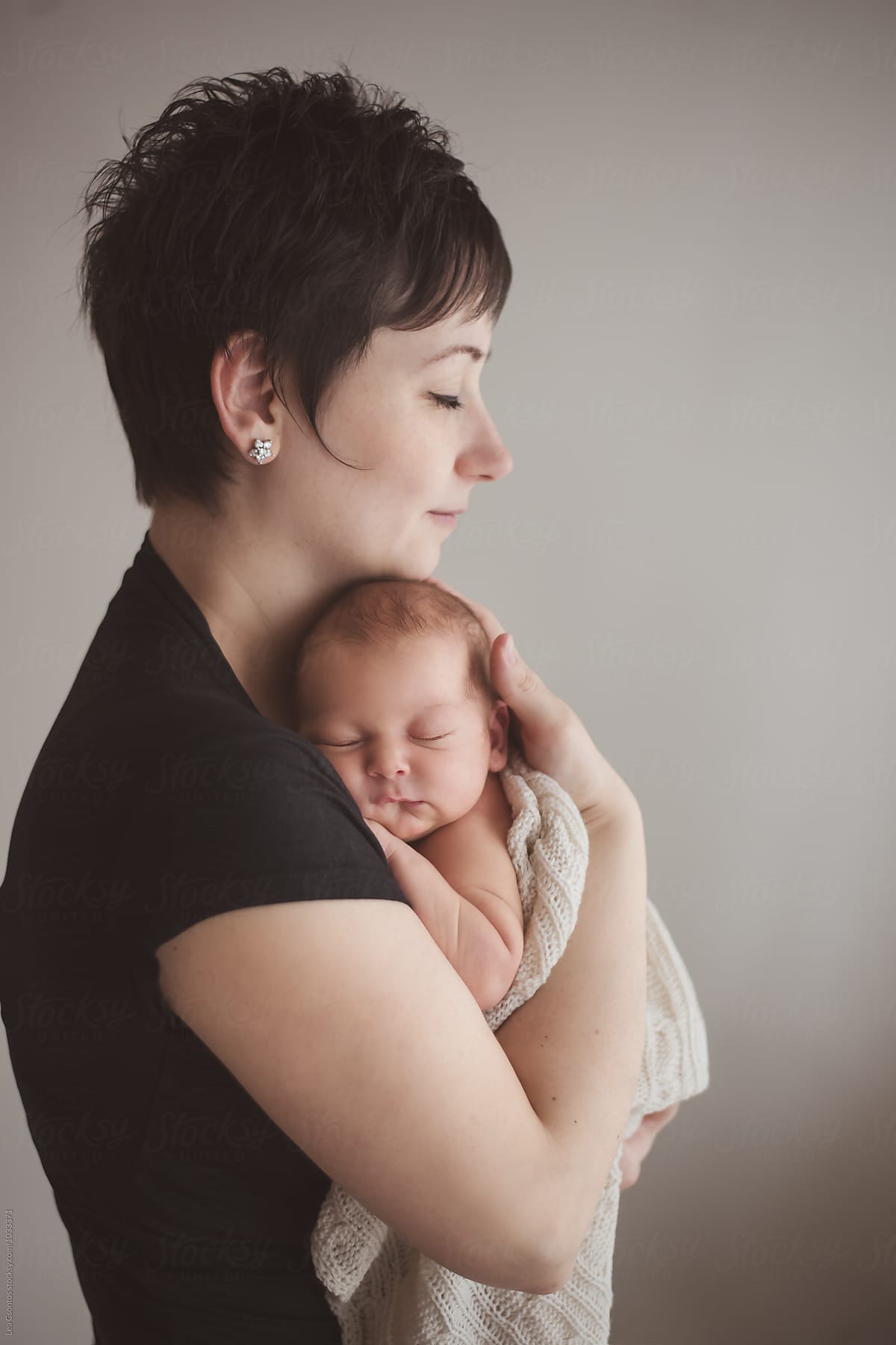 Mother Holding Tight Her Newborn Baby By Stocksy Contributor Lea