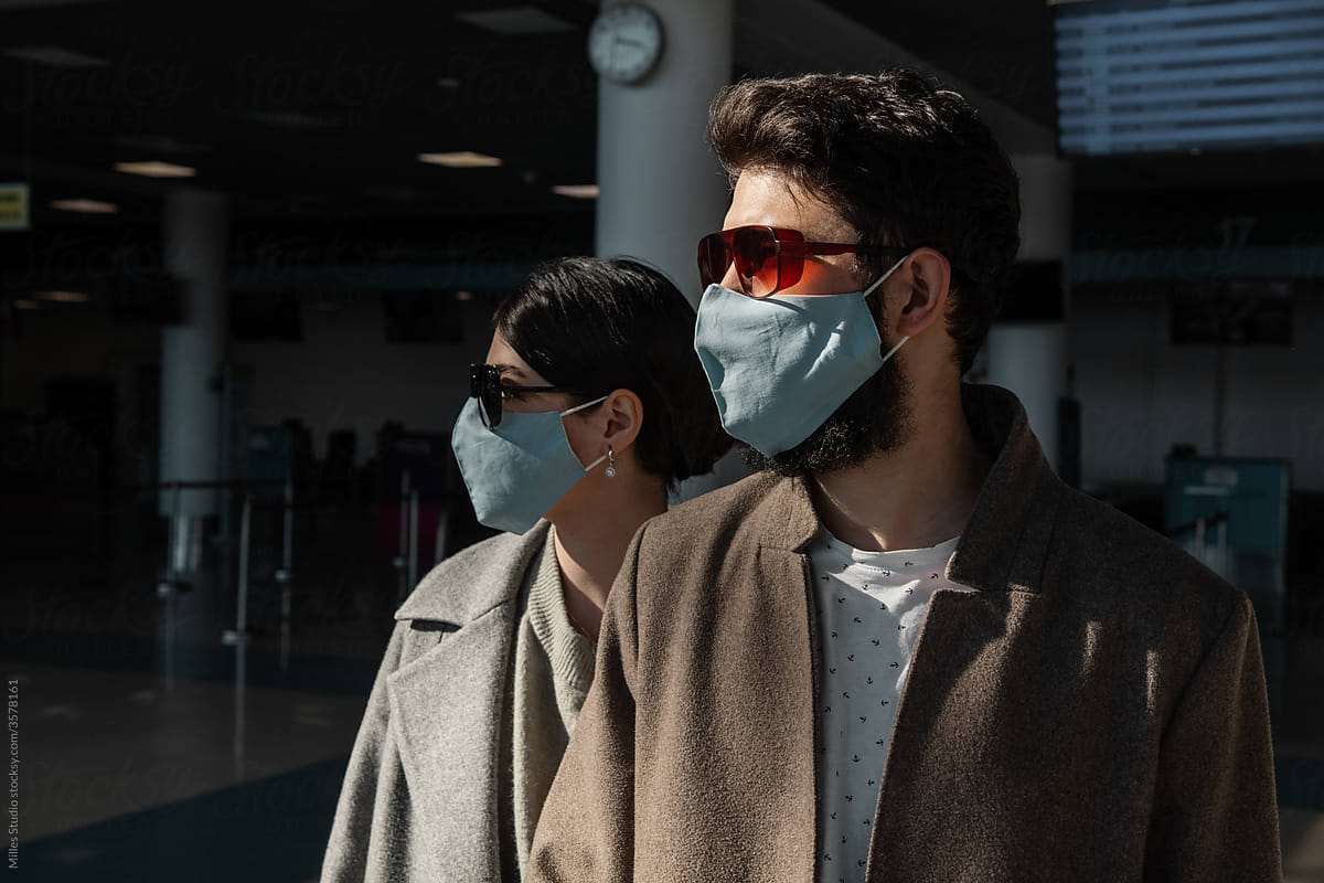 Travelers in masks in airport