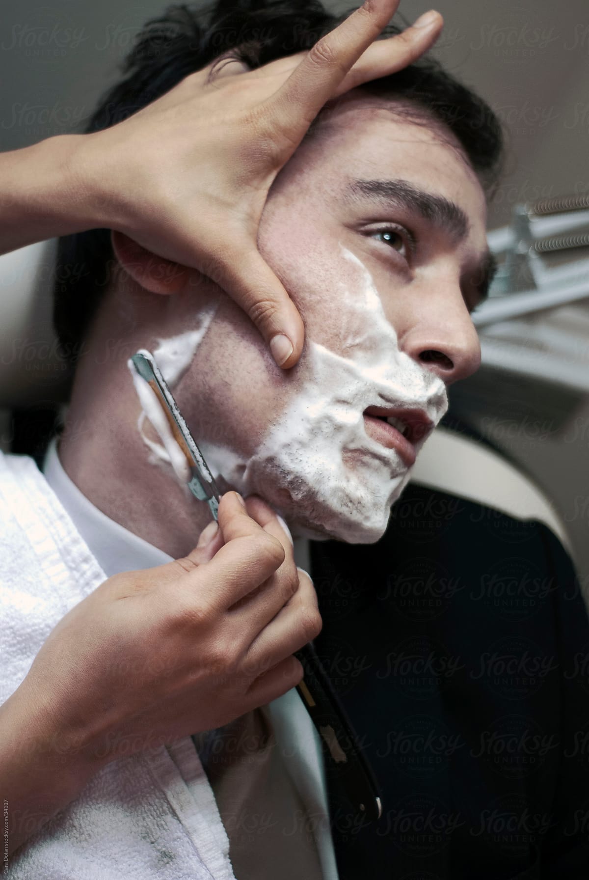 Man receives straight razor shave