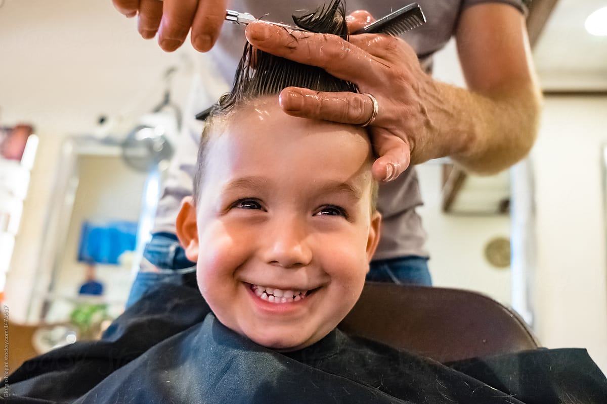 Cute Child Get a Haircut at the Barbershop