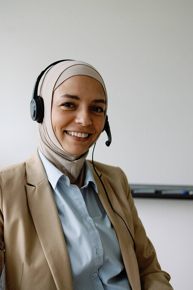 Muslim teacher in headphones have online lesson