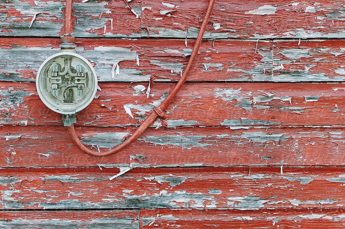 meter on weathered red wall