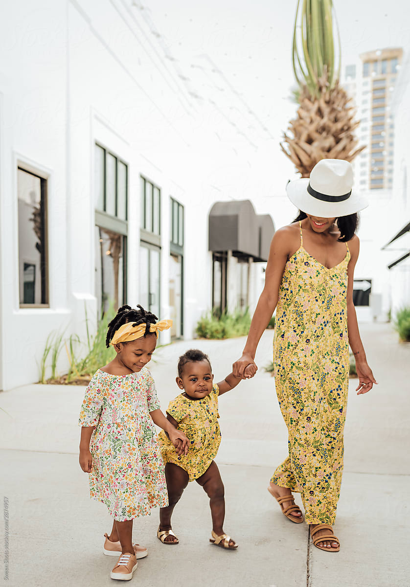 Mom and daughter wearing matching floral dresses