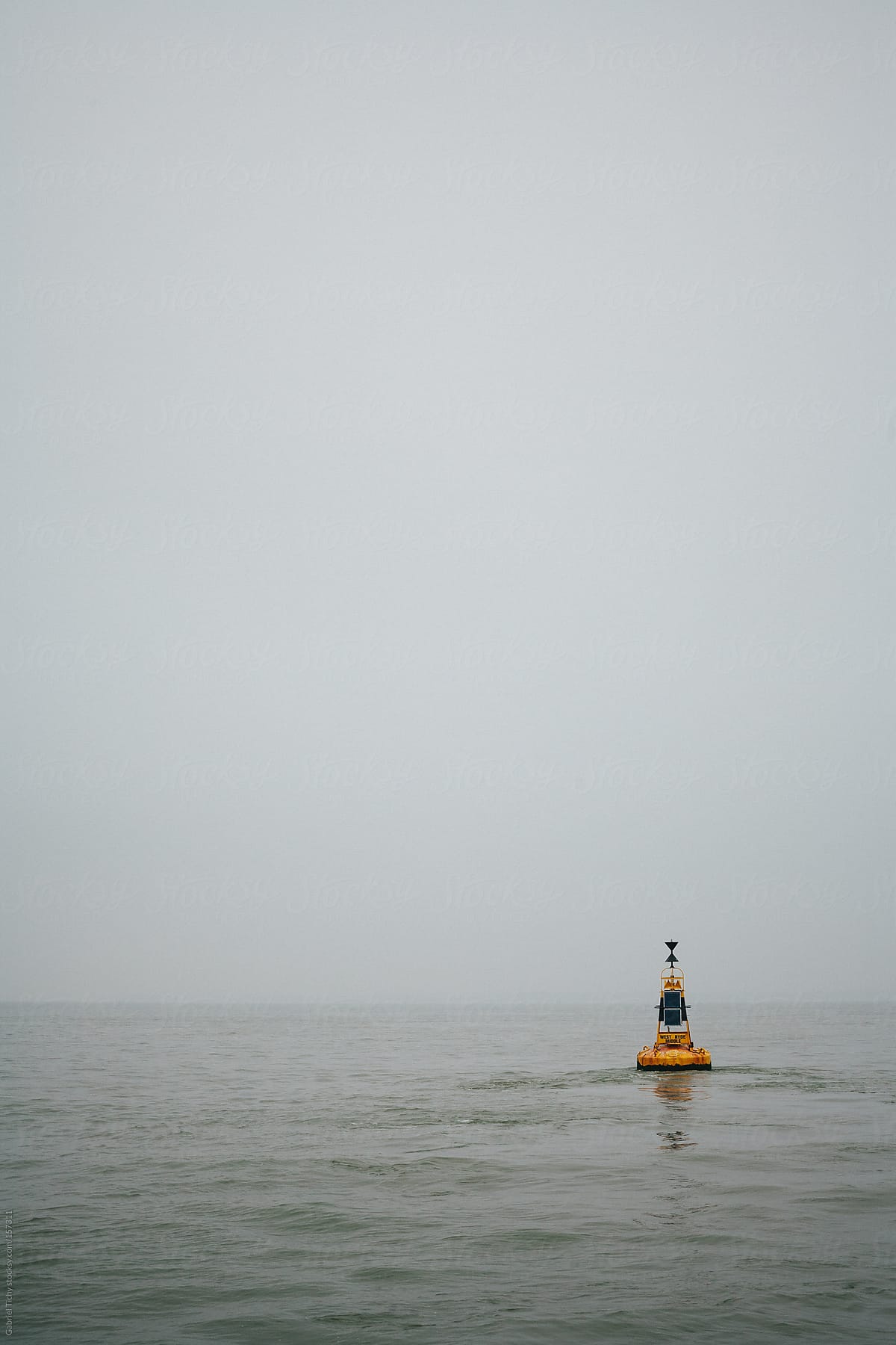 Yellow buoy floating in sea