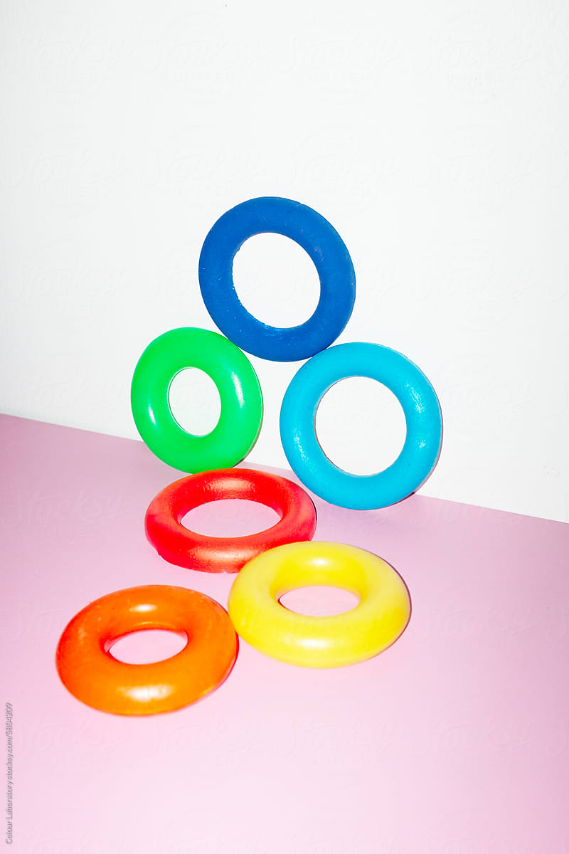 Bright and pastel colourful geometric rings with hard flashlight