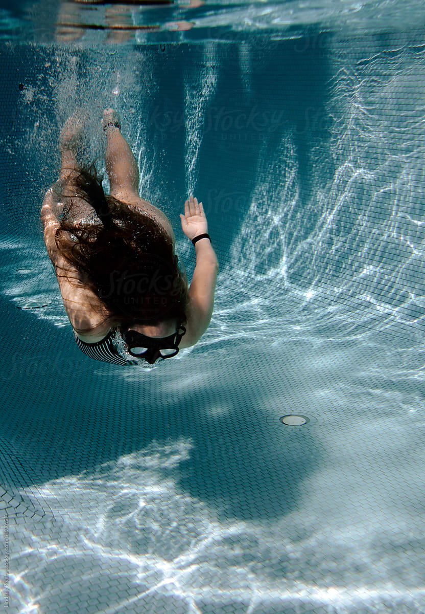Woman Floating Underwater