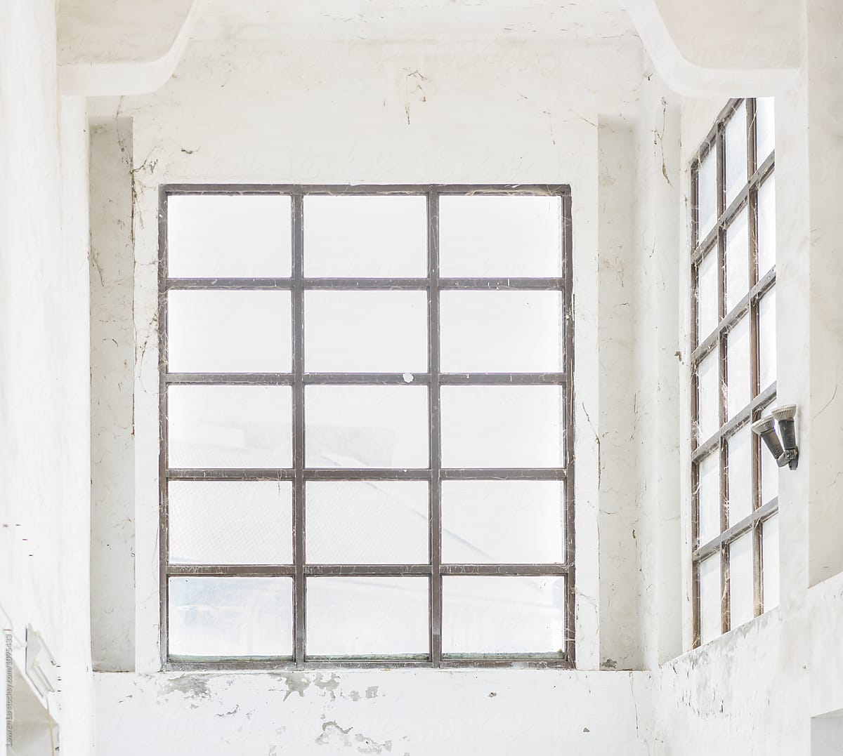 Old white wall with wooden window frame