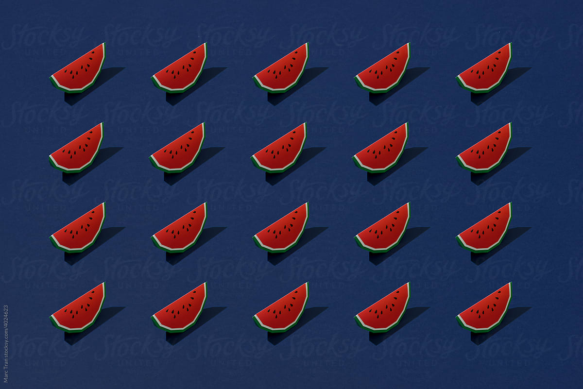 Creative summer food composition of sweet watermelon slices on blue background.
