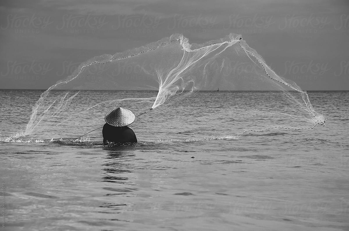 Fishermen casting/throwing a net