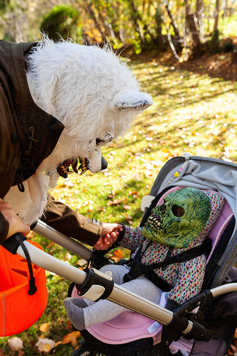 Father and toddler on stroller wearing Halloween costumes
