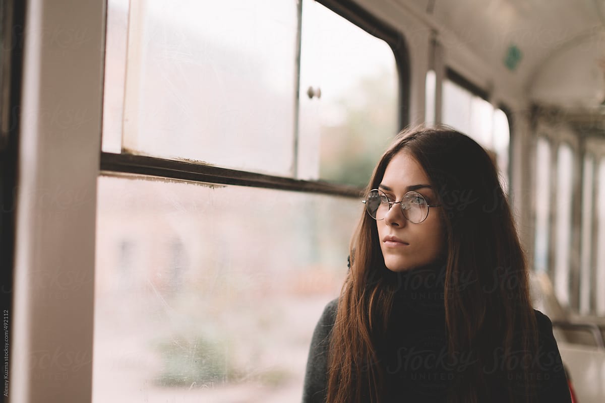 real young female with round glasses