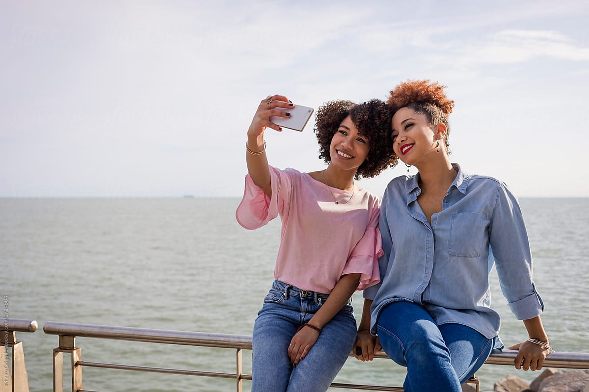 Women using a mobile phone for a selfie