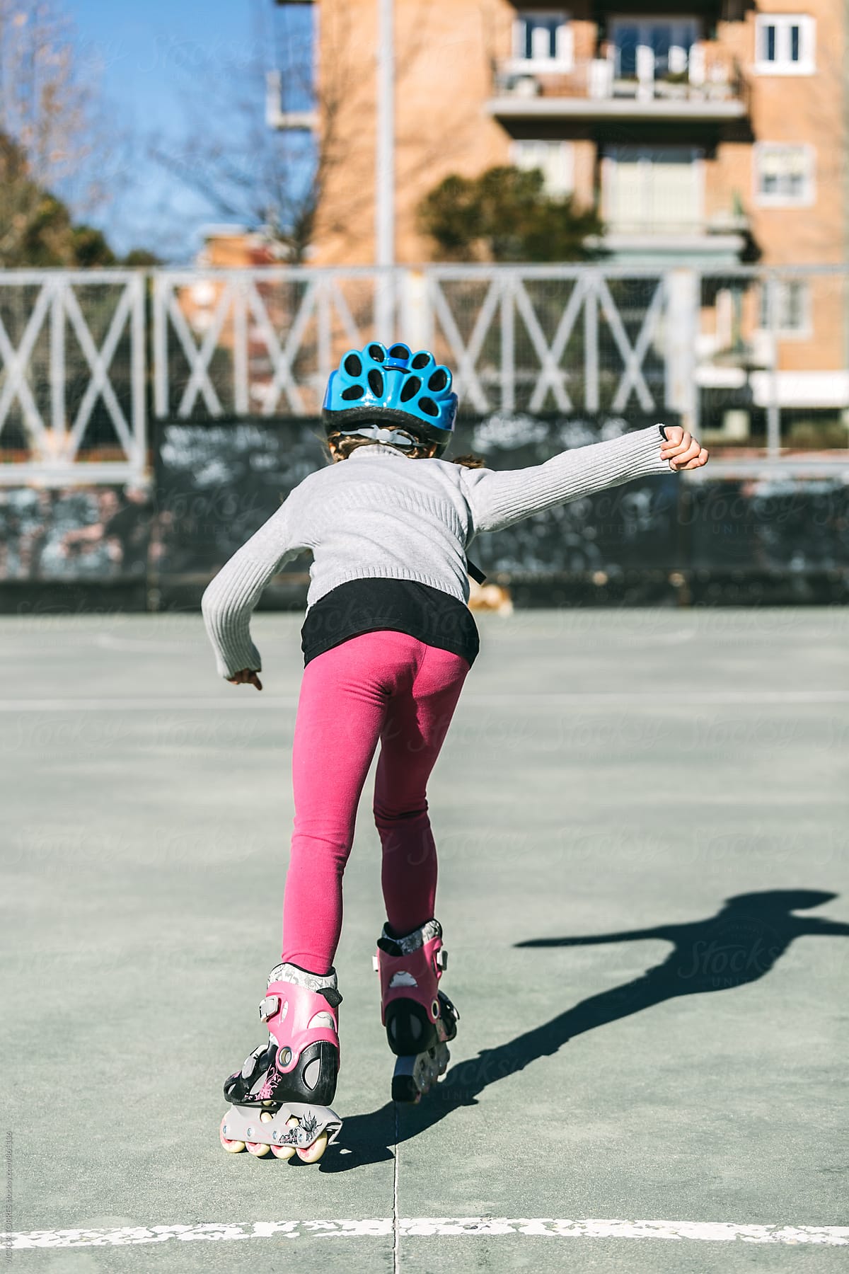 Little Girl Roller Skating in the Park