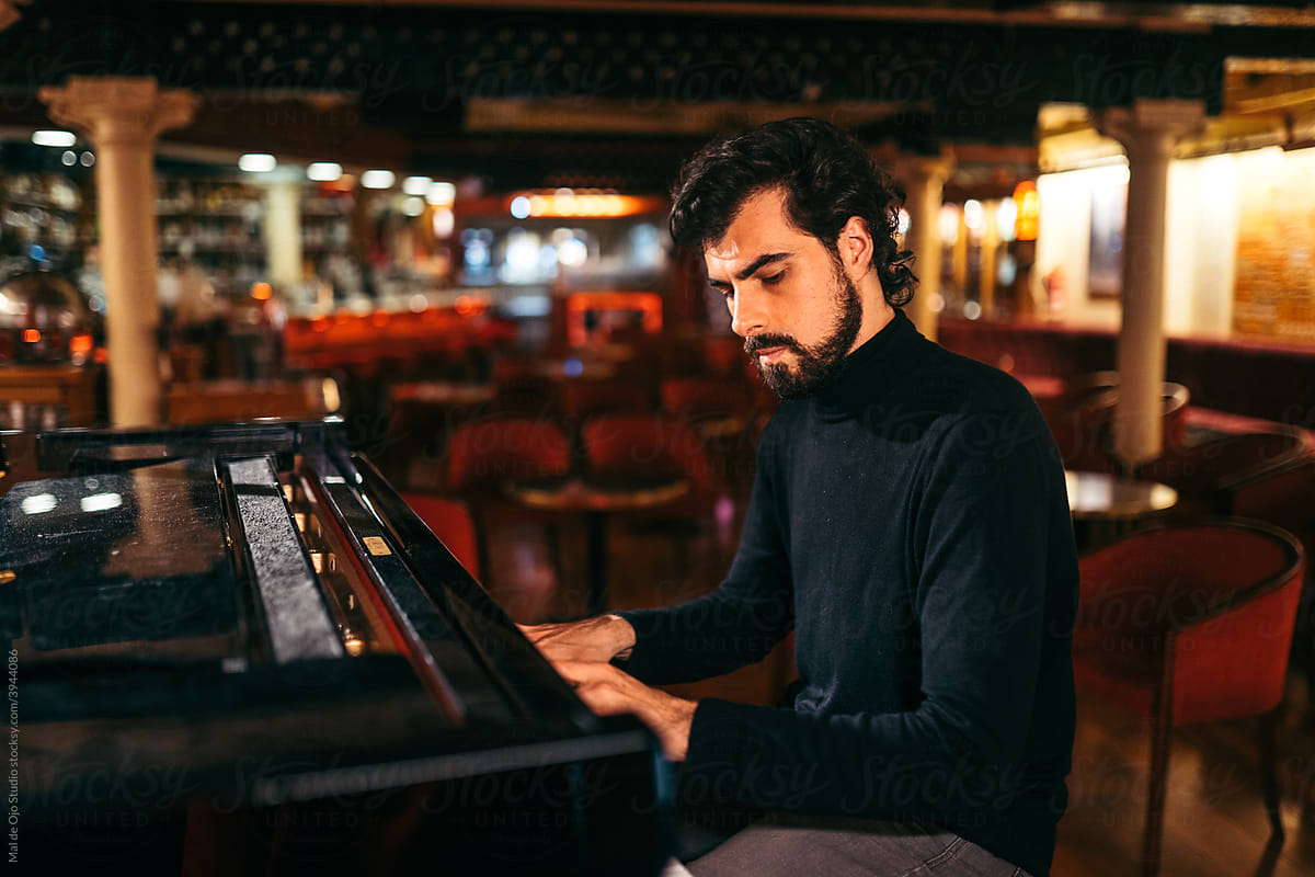 Man playing piano in a club