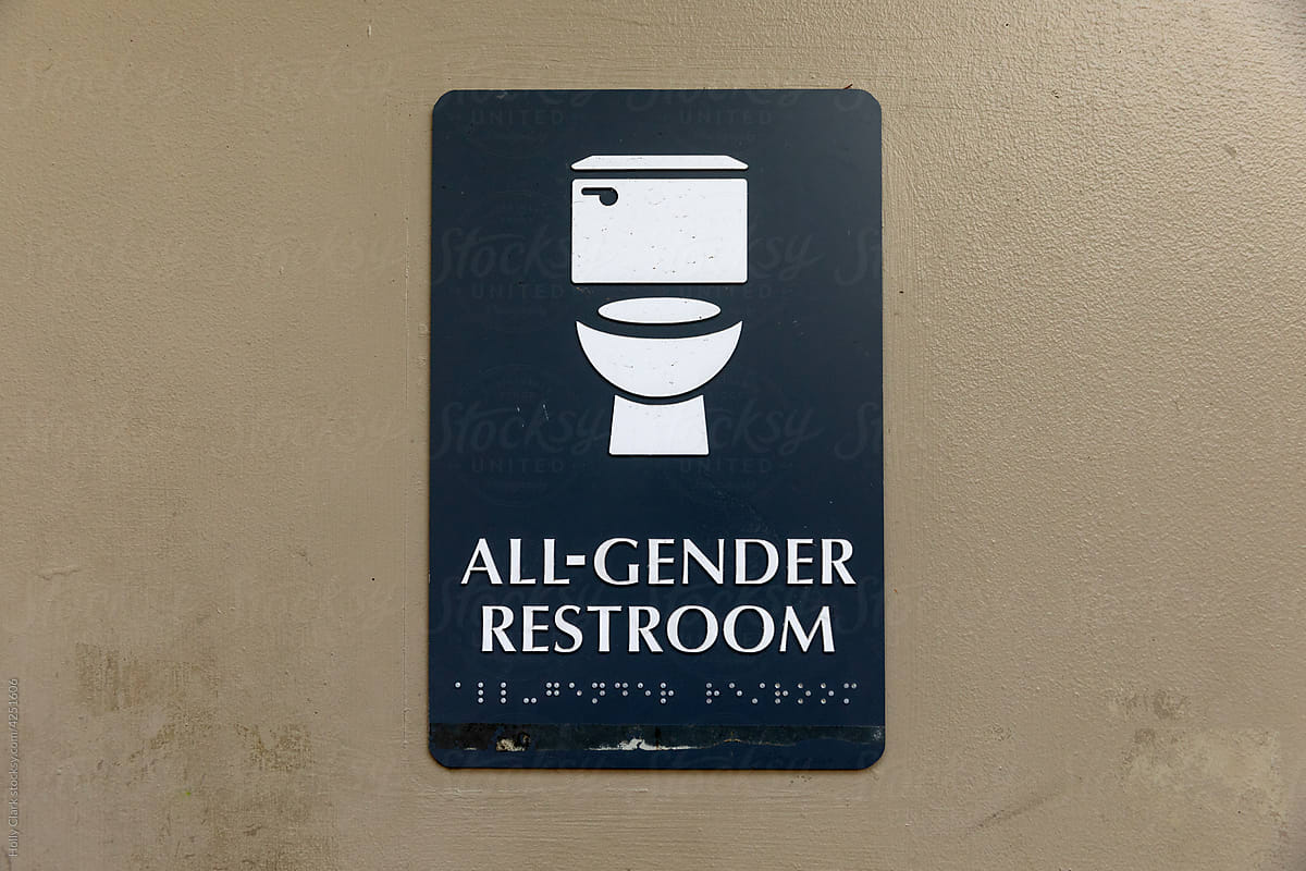 Gender-neutral restroom sign on bathroom door.