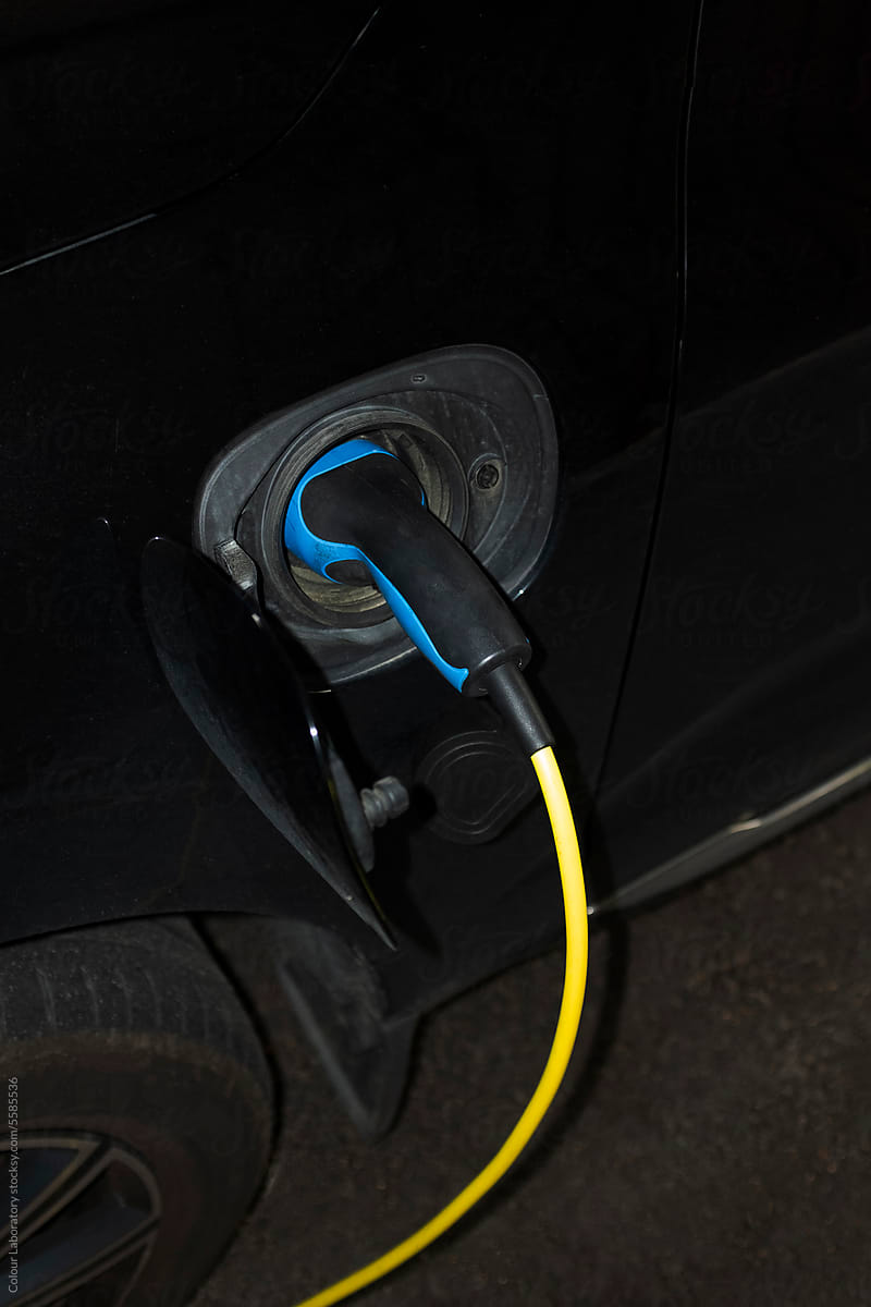 Photo of modern charger / wire in a electric car with hard flashlight