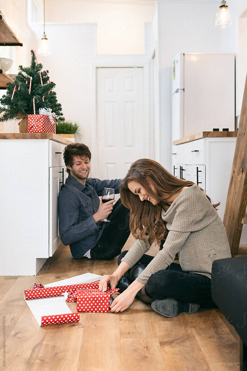 Home: Couple Having Fun Getting Ready For Christmas In Tiny Hous