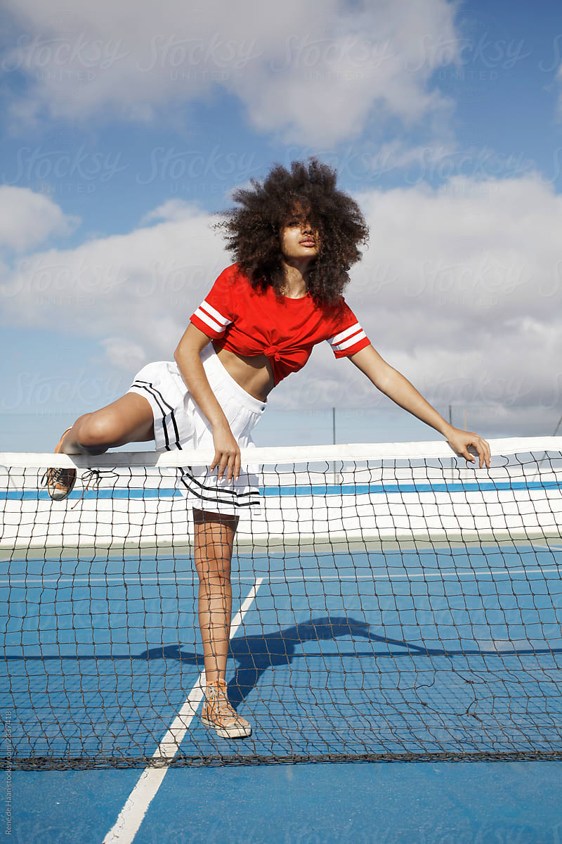 young black woman at tennis court