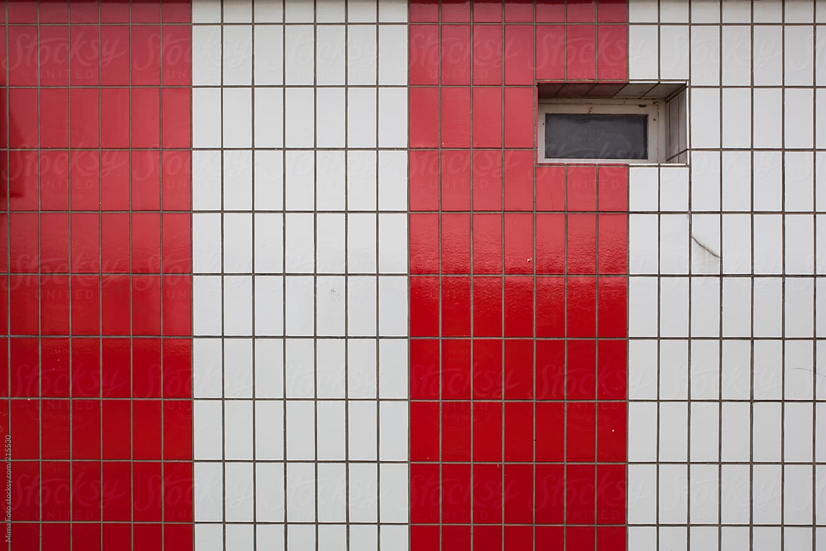 Red white tiled wall with window