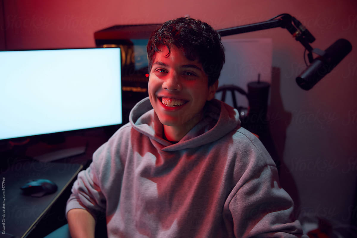 Young Smiling Man Playing Video Games Online