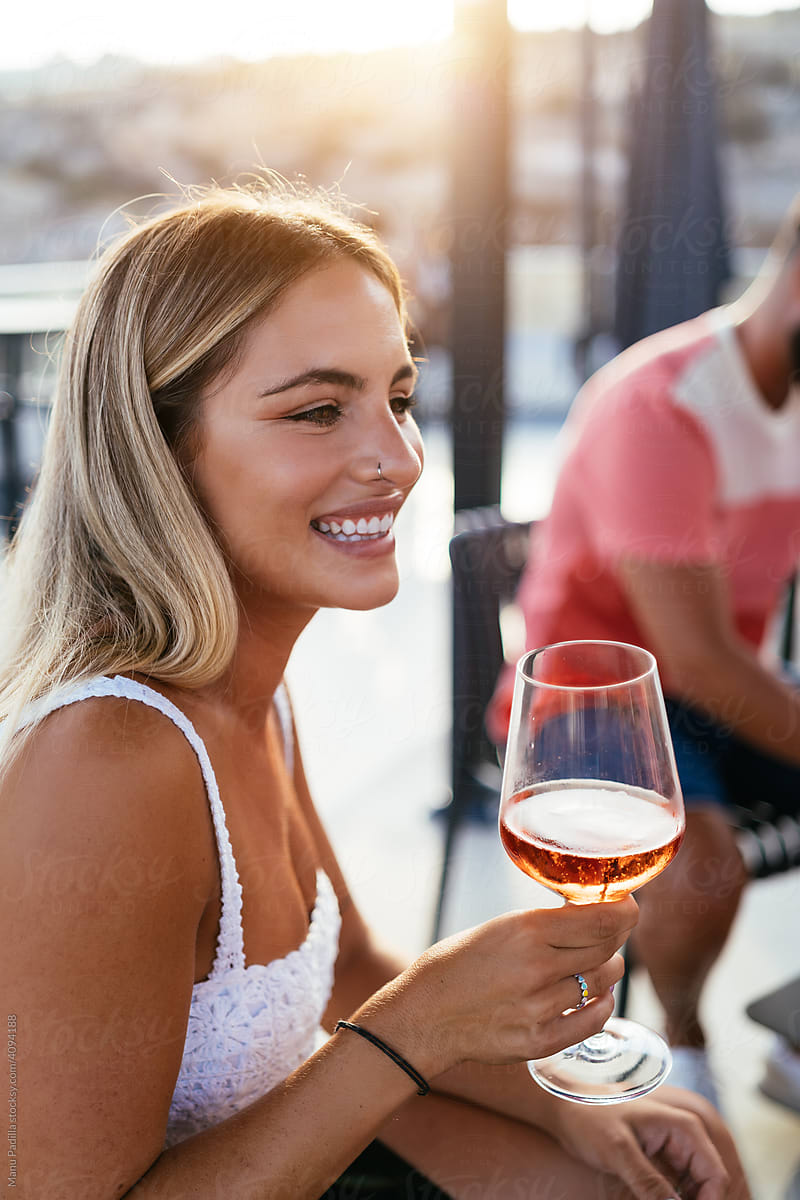Happy woman with glass of wine