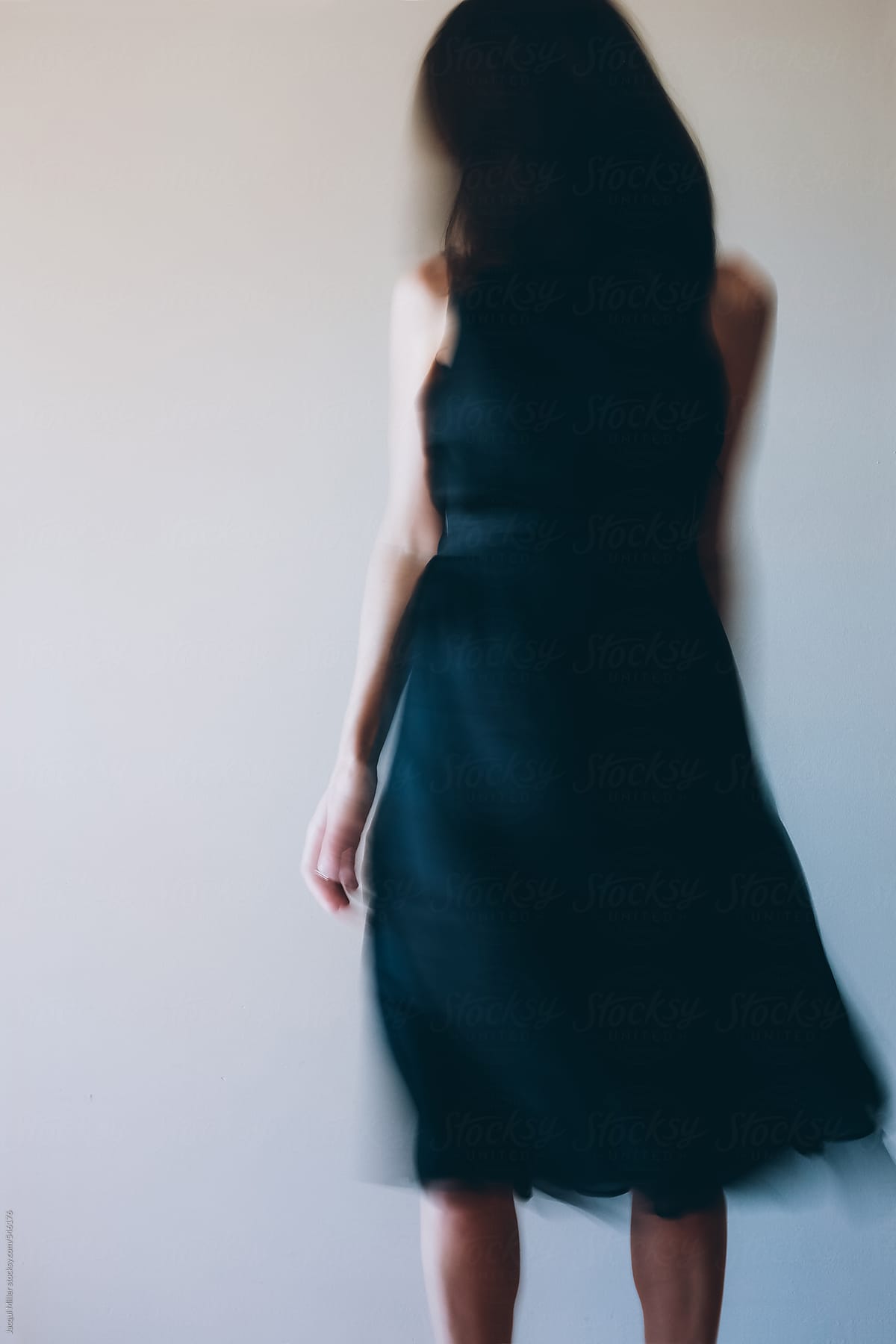 Unrecognisable Woman Moving In A Flowing Black Dress By Stocksy Contributor Jacqui Miller 9490