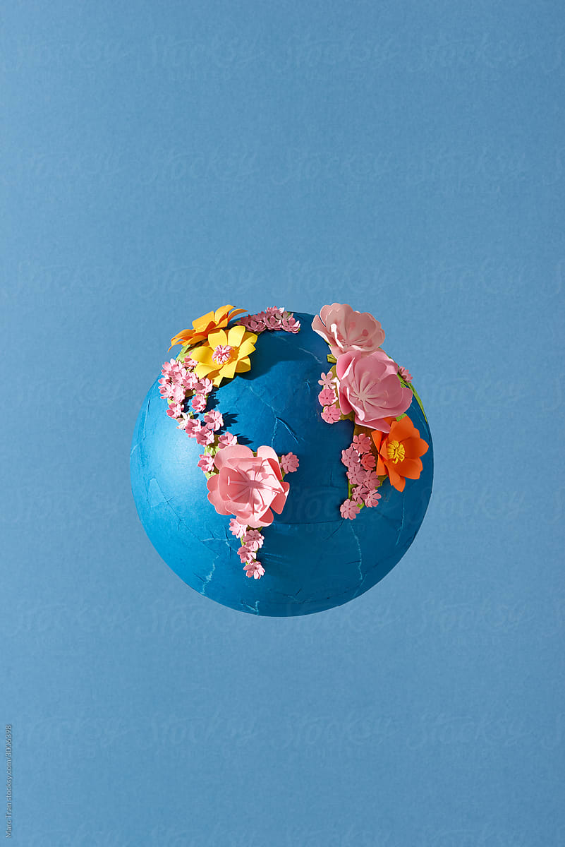 Paper world map in flowers