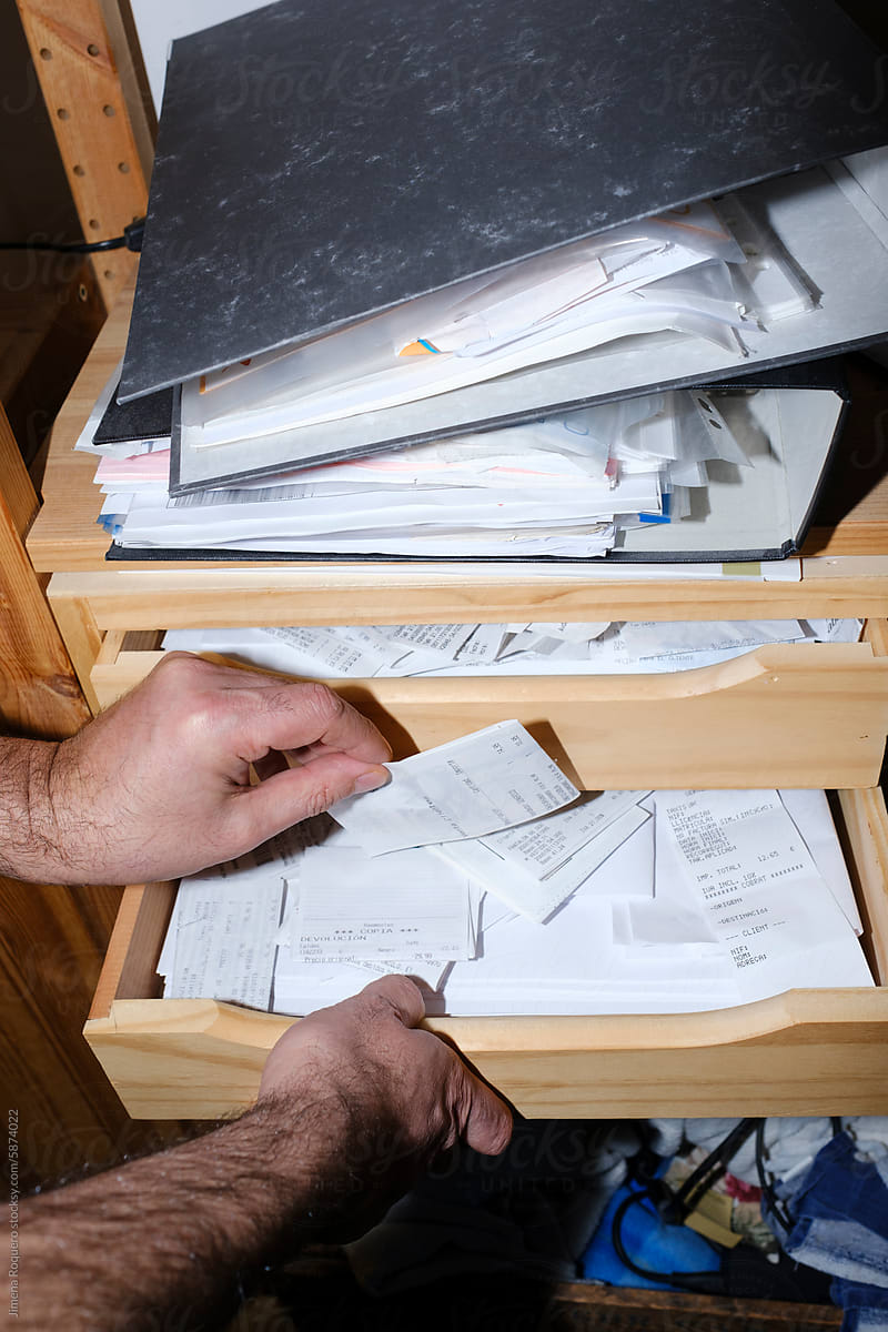 Man organizing receipts for his business accountability