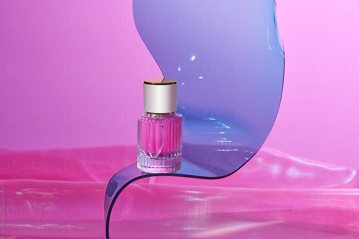 luxury perfume bottle spay on pink background