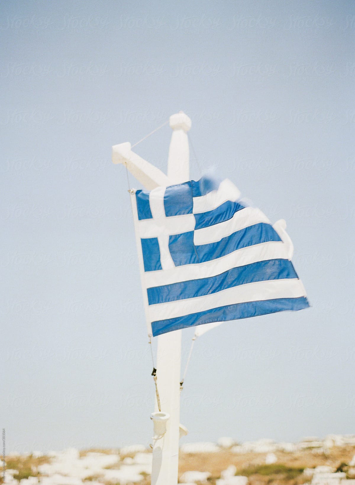 Greece flag in the wind on the island of Mykonos