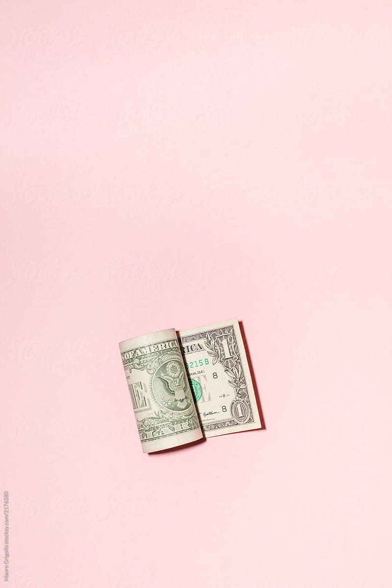 US Dollar Bill On a Pink Background