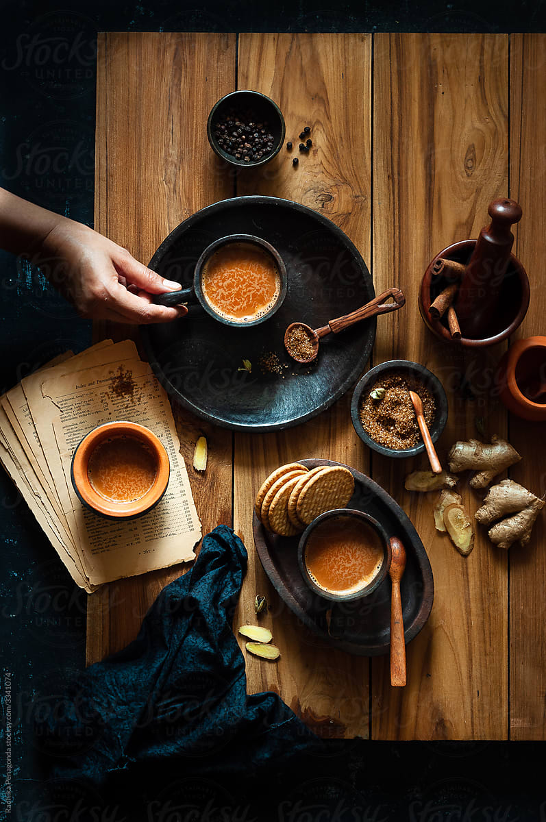 Indian Chai time scene with hand holding cup