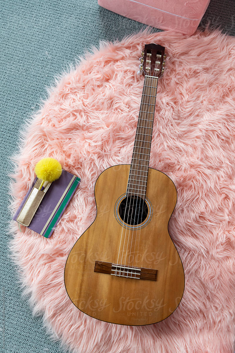 Furry Pink rug with acoustic guitar still life journal book