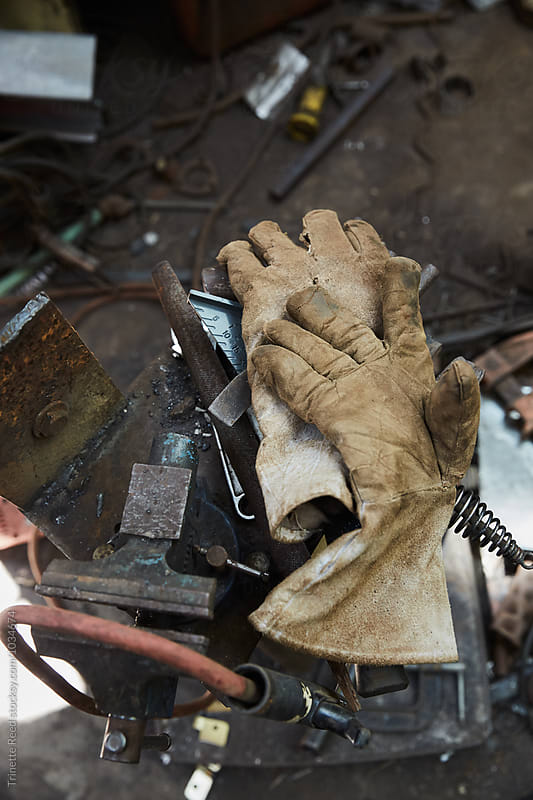 Gloves in a messy metal shop