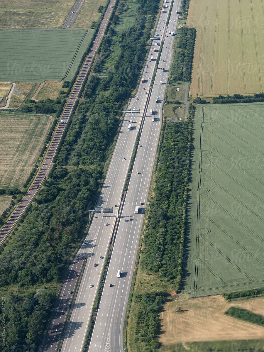 German autobahn cuts through a rural landscape, airplane shot